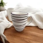 Perfect for astrology enthusiasts, the Zodiaco ceramic mug combines style with functionality. This ceramic coffee mug showcases zodiac-inspired patterns, making it a fun and personalized option for your morning coffee or tea. Add this cute ceramic mug to your collection and let your zodiac sign shine through every sip.