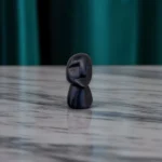 Volti Antichi mini sculpture – earthy-toned ancient stone face sculpture