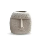 Vaso Sorriso ceramic vase with a whimsical smiley face design, ideal for playful living room décor