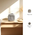 Vaso Sorriso ceramic vase with a whimsical smiley face design, ideal for playful living room décor