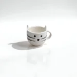 Miao Magico ceramic coffee cup with a playful cat design for cat lovers